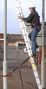 Engineer climbing ladder whilst connected via Rope Grab